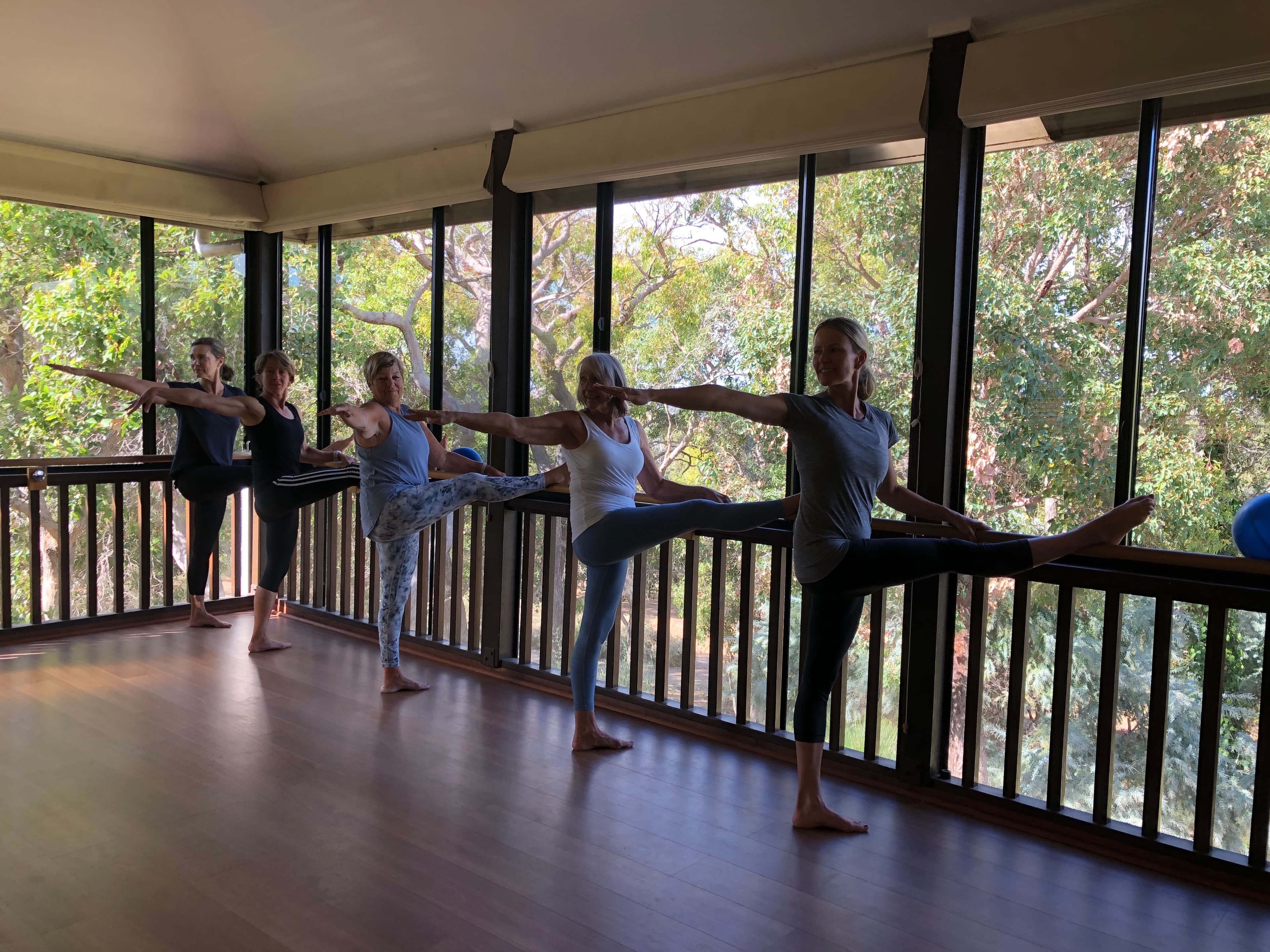 Students stretching at the barre